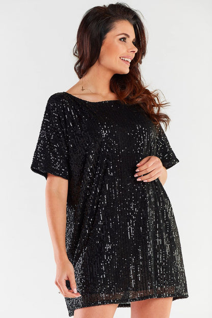Side profile of a glamorous black sequined dress, highlighting its exquisite design and luxurious appeal for evening occasions.