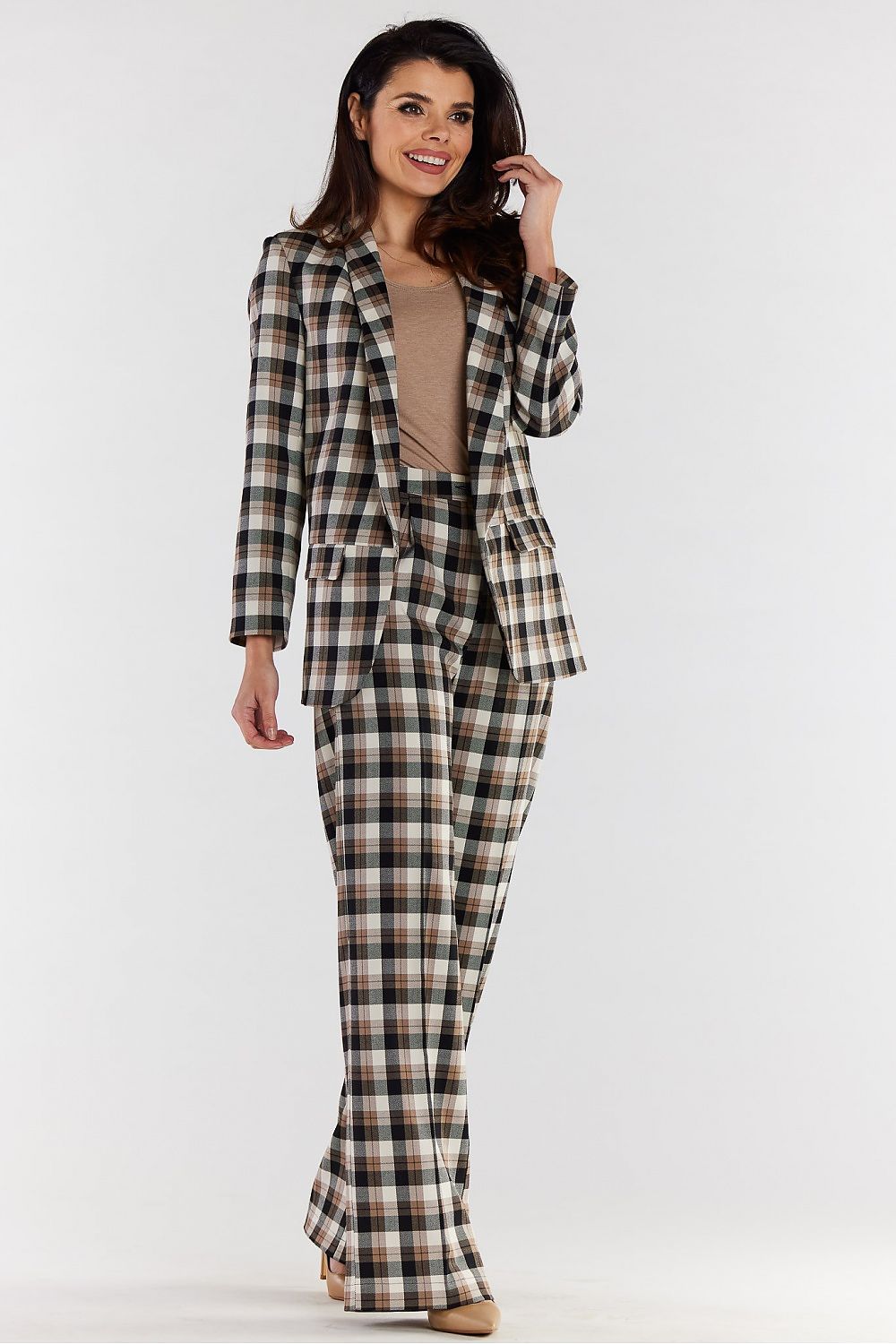 Stylish high-waisted wide-leg trousers paired with a plaid blazer, showcasing a luxurious and modern womenswear ensemble.