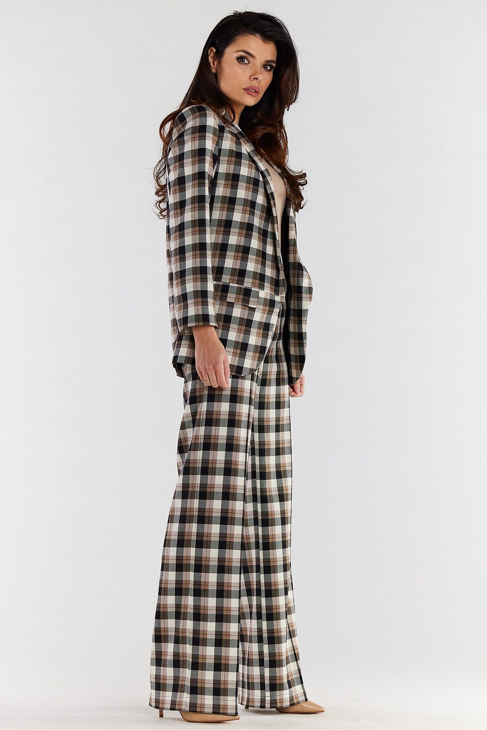 Side profile of high-waisted wide-leg trousers with an exquisite plaid pattern, worn with a tailored blazer, perfect for a luxurious office or evening outfit.