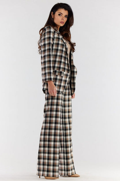 Side profile of high-waisted wide-leg trousers with an exquisite plaid pattern, worn with a tailored blazer, perfect for a luxurious office or evening outfit.