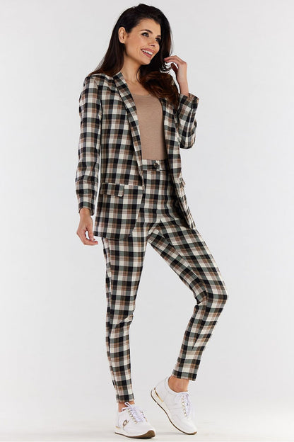 Elegant model showcasing a stylish urban check jacket set against a minimalist background, perfect for both sophisticated and casual ensembles.