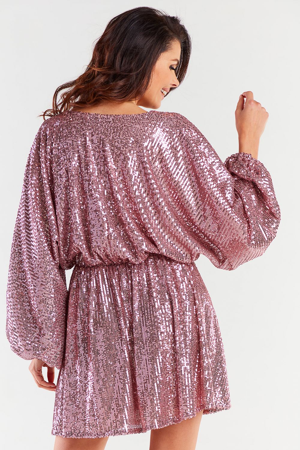Back view of a stunning loose evening dress in shimmering pink, showcasing elegant wide sleeves and a figure-enhancing design.