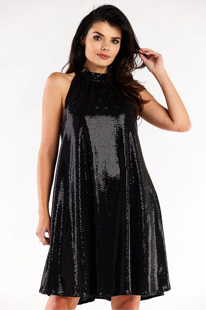 Stylish loose flared evening dress in luxurious black, featuring a ruffle neckline, captured from the front, ideal for glamorous events.