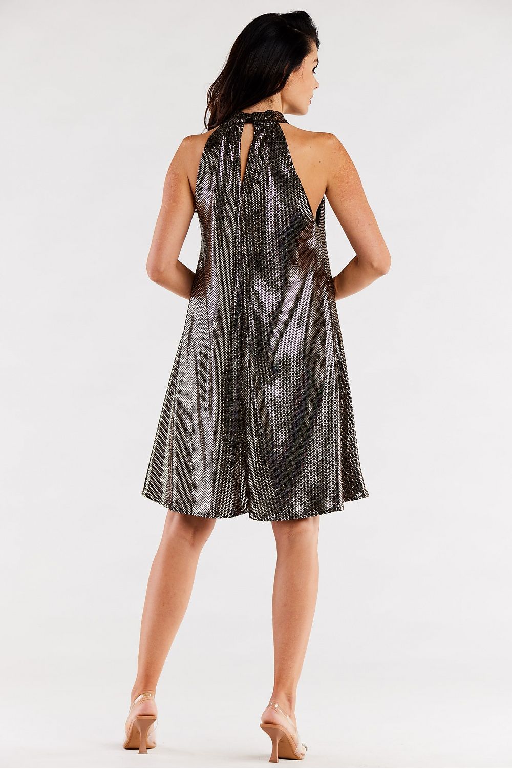 Elegant back view of a chic loose flared evening dress with a halter neck and ruffle detailing by Awama, crafted in Poland. The dress flows gracefully, showcasing luxurious fabric.