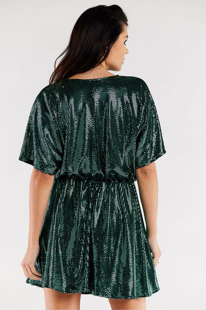 Elegant flared evening dress in shimmering green, showcasing a flattering sweetheart neckline and comfortable elastic waist. Ideal for special occasions.