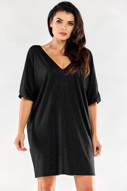 Stunning black loose evening dress with a glamorous V-neckline and relaxed fit, ideal for upscale events and special occasions.