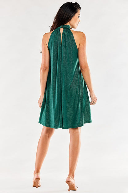 Elegant green flared evening dress featuring a decorative neckline, showcasing a captivating back view against a soft neutral backdrop. Perfect for formal occasions.