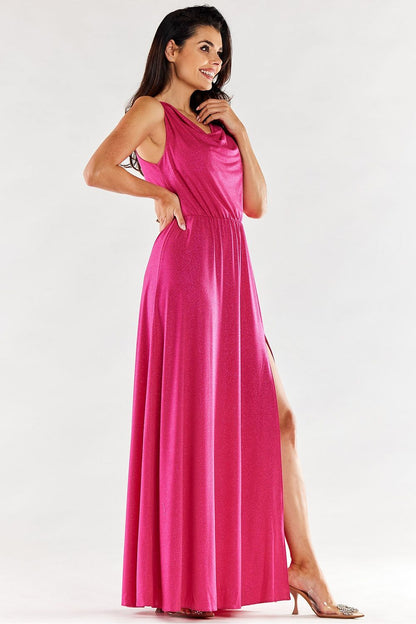 Stylish pink long dress featuring a flattering ruffled neckline and side slit, model poses gracefully, exuding elegance.