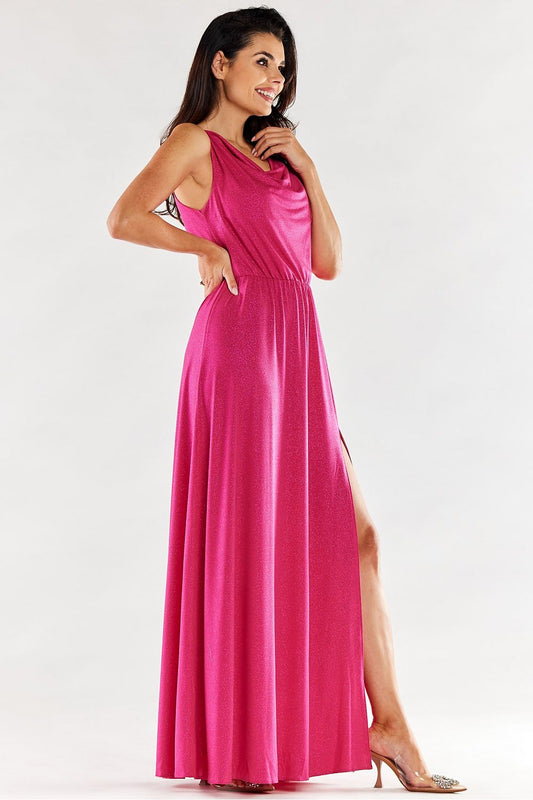 Stylish pink long dress featuring a flattering ruffled neckline and side slit, model poses gracefully, exuding elegance.