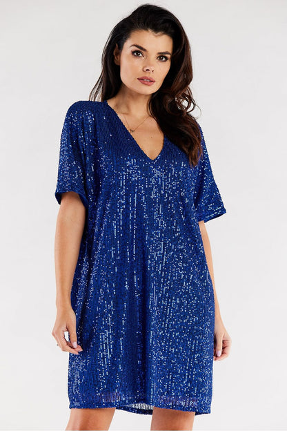 Sophisticated loose evening dress in rich blue with a sparkling sequined surface and an elegant V-neck, tailored for a luxurious evening affair.