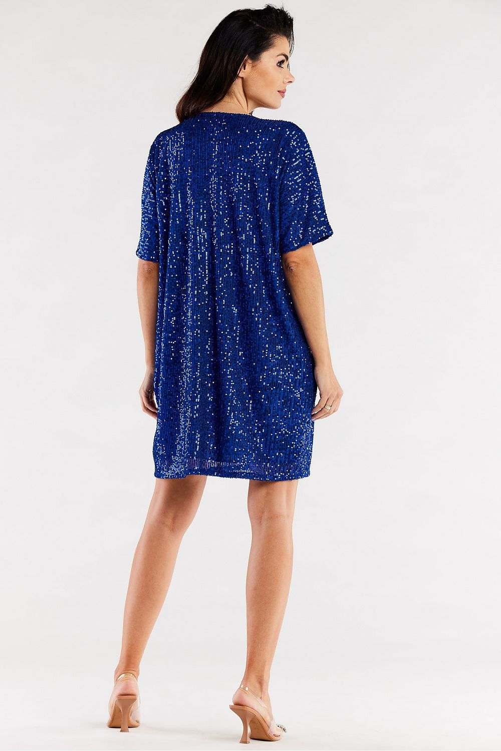 Back view of an elegant loose evening dress in rich blue with a sequin design, showcasing a relaxed silhouette and versatile styling for evening events.
