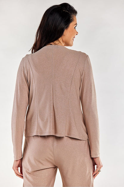 Elegant loose-fitting long-sleeved bedspread jacket in a soft beige hue, showcasing a smooth back design, perfect for adding a touch of luxury to your loungewear collection. Crafted in Poland, this stylish jacket combines comfort and sophistication.