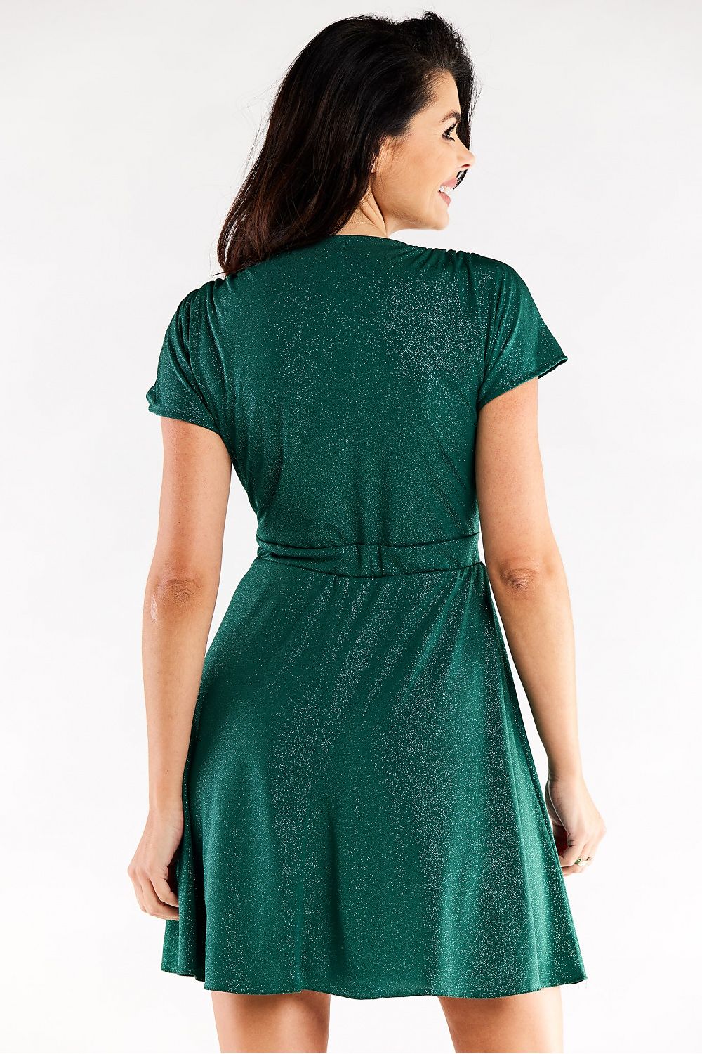 Back view of an exquisite green short flared evening dress by Awama with decorative creases, model showcases the elastic fit design gracefully.