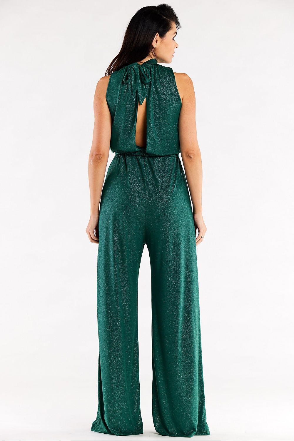 Sophisticated back view of a green wide-leg suit with tied collar and elegant design elements.