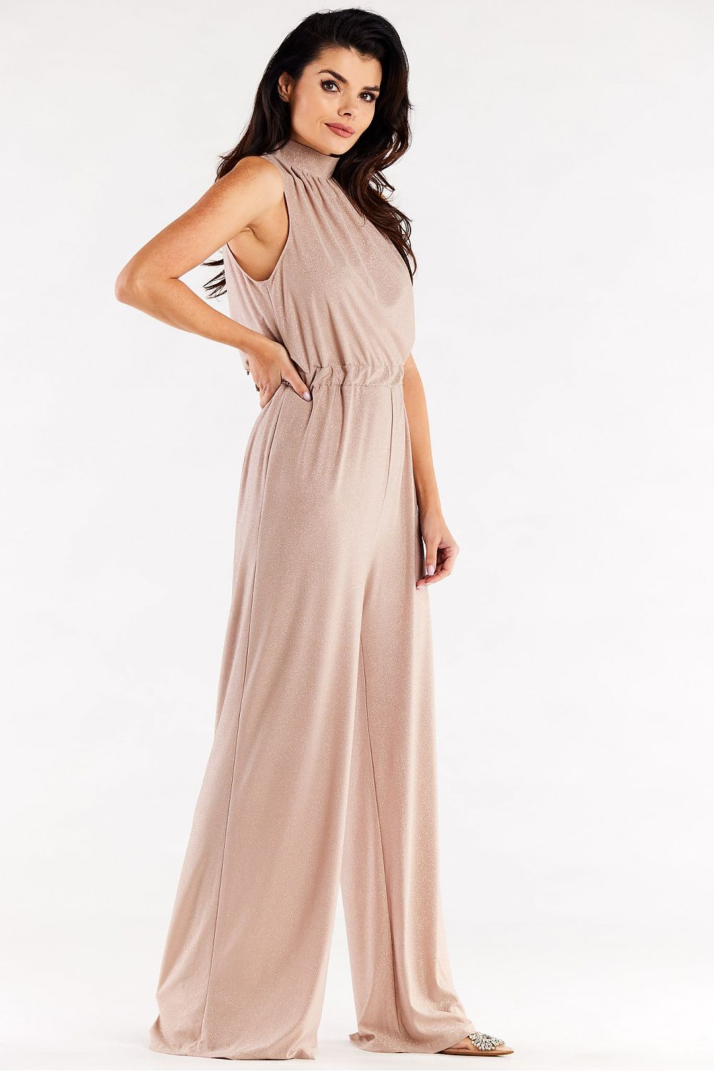 Luxurious wide-leg suit in soft blush with crinkled neckline, showcasing a model in an elegant pose, perfect for sophisticated occasions.