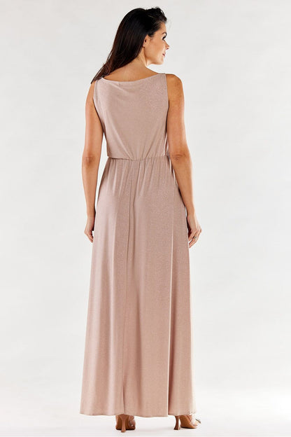 Back view of a graceful long pink dress with ruffled neckline and elegant side slit, showcasing its luxurious yesteryear-inspired design.