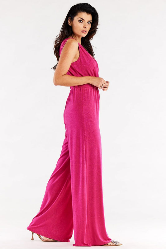 Side view of a luxurious pink wide leg jumpsuit with an envelope top, featuring a relaxed fit and elastic waistband, embodying sophistication and comfort.