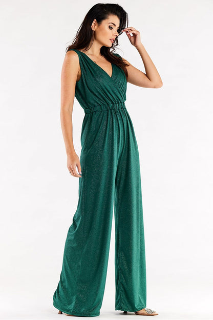 Sophisticated green jumpsuit with wide-leg silhouette and envelope top, showcasing an elegant fit at an angle.