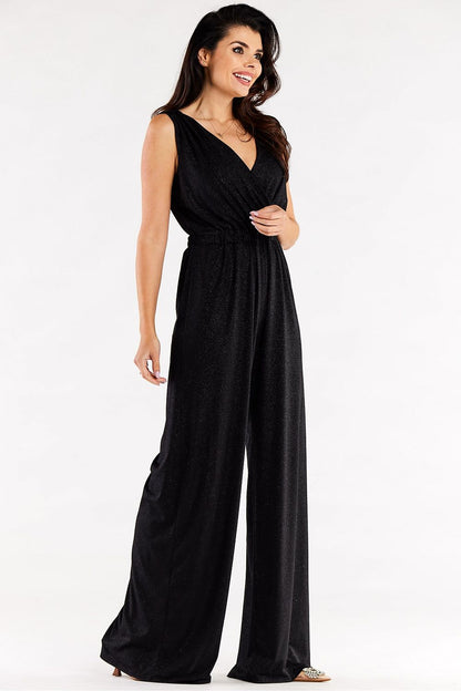 Beautiful black jumpsuit with wide leg cut and flattering envelope neckline, highlighting a luxurious and sophisticated style.