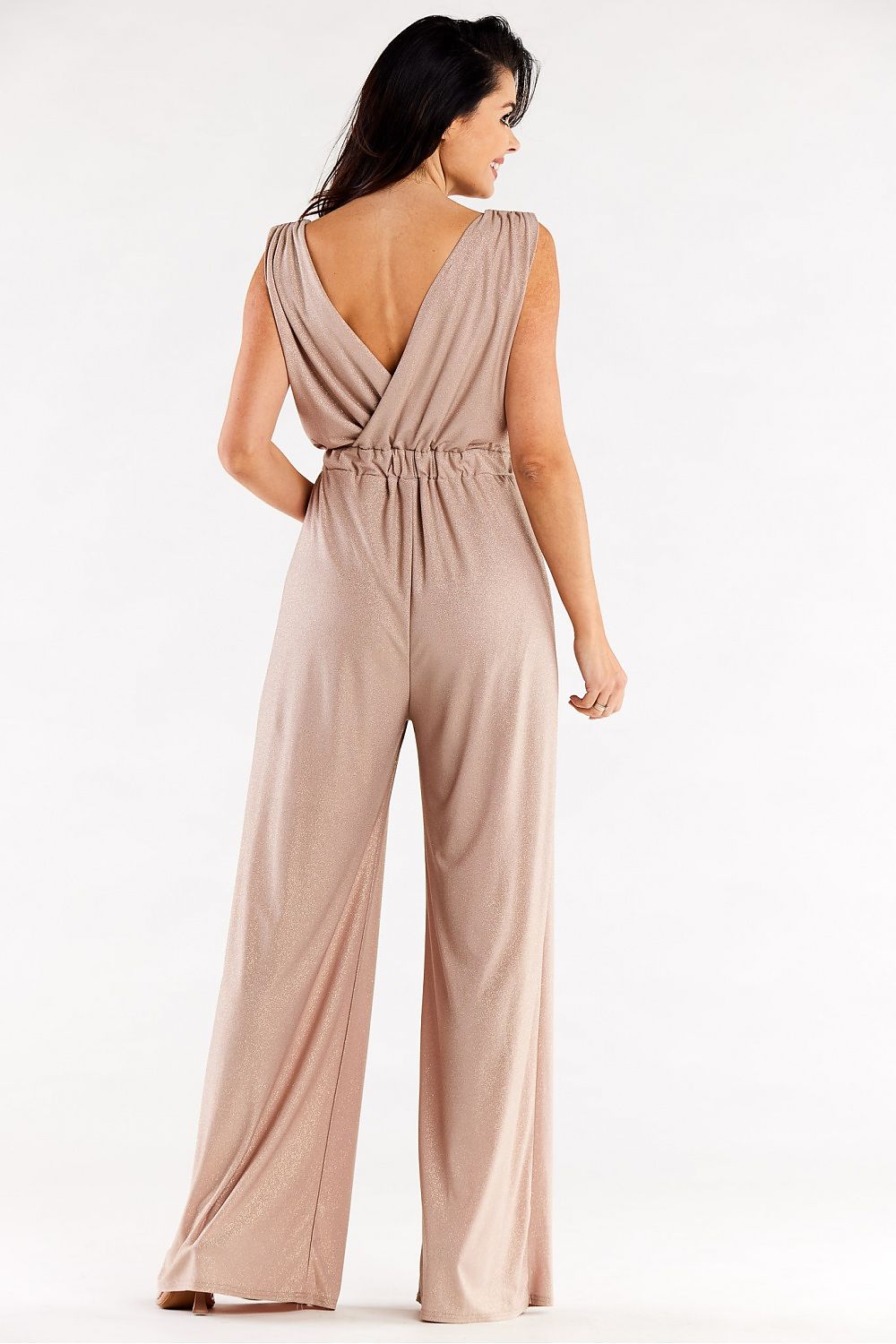 Stylish beige wide leg jumpsuit featuring a sophisticated v-back detail, displayed from the back, perfect for an upscale event or evening outing.