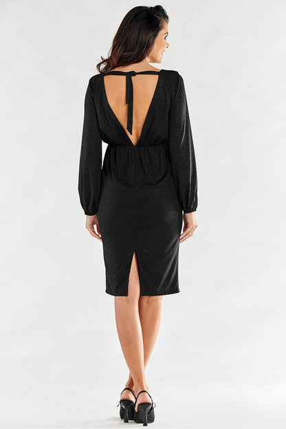 Sophisticated back view of a black evening dress featuring an open back with a tie detail and a sleek slit, exuding luxury for upscale events.