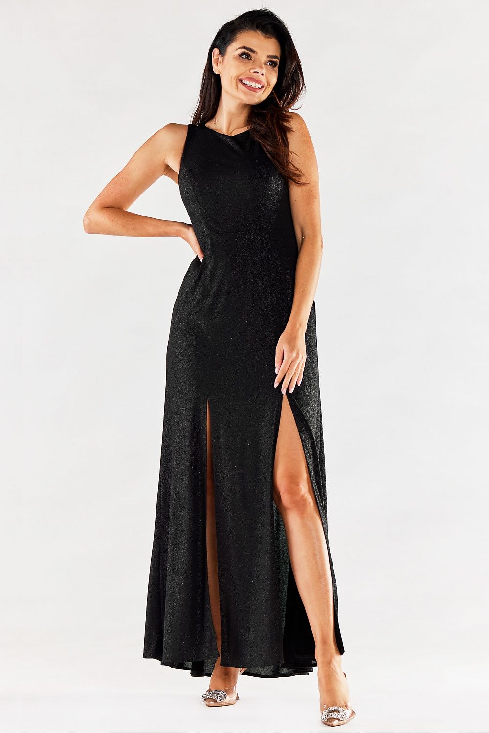Chic black long dress by Awama, designed with flattering front slits and a fitted bodice, embodying elegance for formal events.