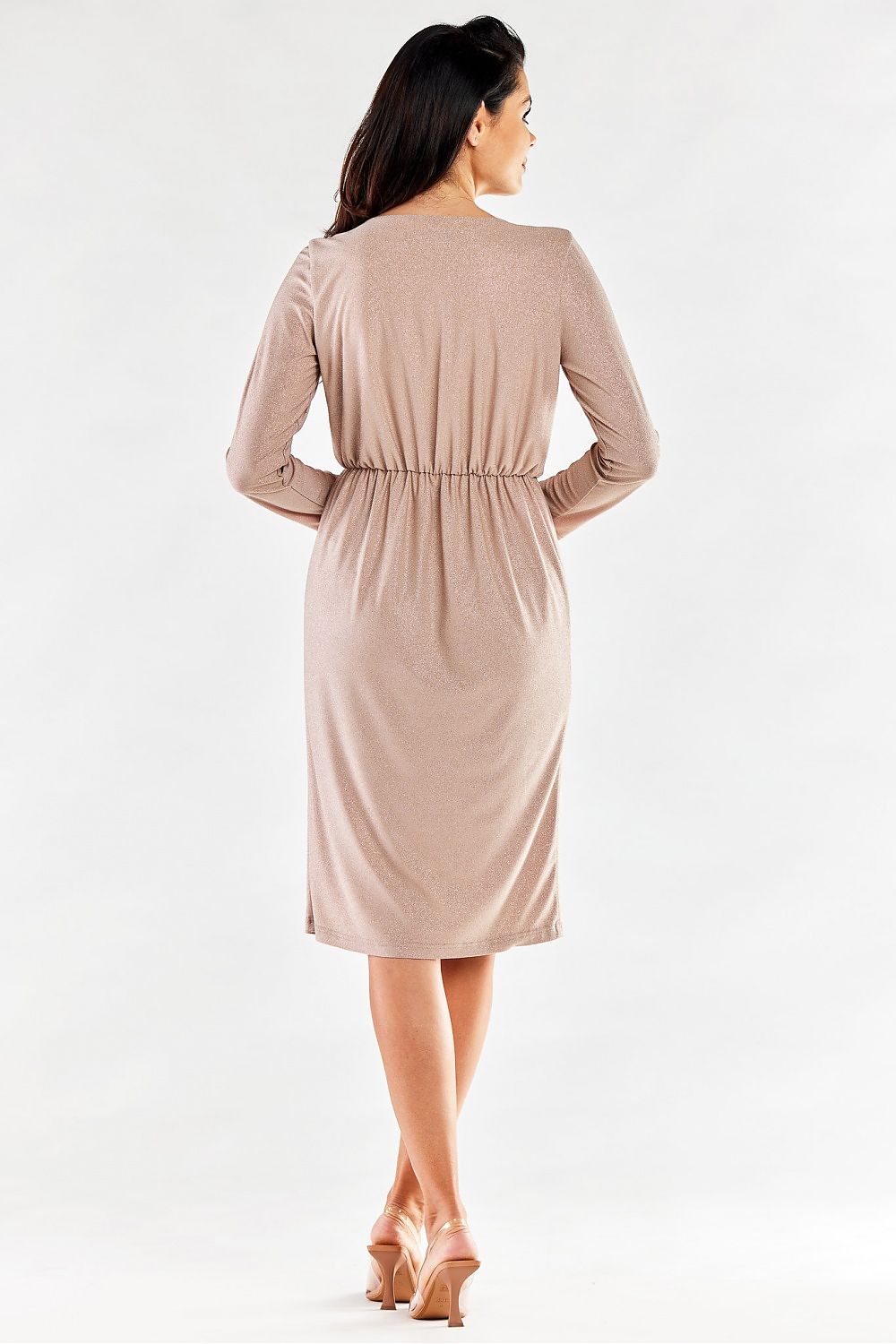 Elegant envelope dress with long tapered sleeves and an elastic waistband, showcased from the back. The dress features a subtle shimmering fabric in a soft beige tone, perfect for sophisticated occasions. Made in Poland by Awama for a luxurious feel.