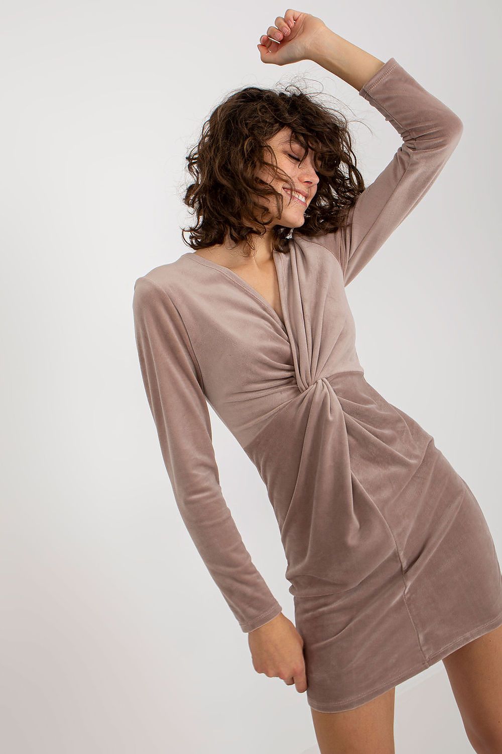 Elegant beige velour evening dress with long sleeves and a twisted front design, exuding sophistication and charm.