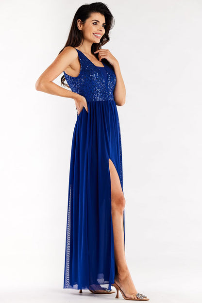 Side view of the exquisite blue long dress by Awama, highlighting the elegant high slit and sparkling sequined details.