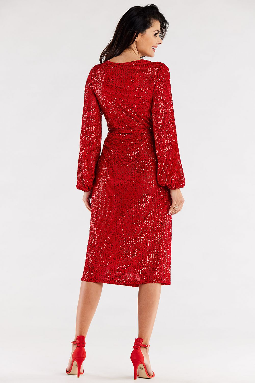 Back view of a luxurious red evening dress with a tie waist and crinkled sleeves, accentuating elegant curves.