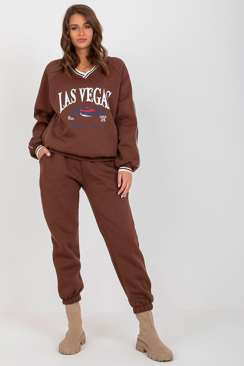 Trendy brown cotton blend sweatshirt set adorned with a vintage Las Vegas graphic, elegantly combined with matching pants for a luxurious and casual look.