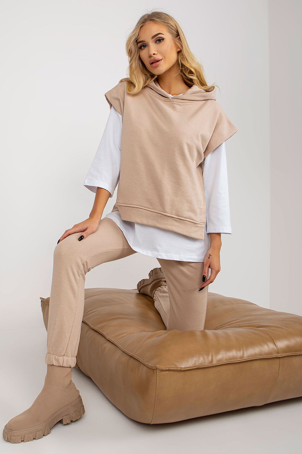 Elevate your wardrobe with the Premium Ex Moda 3-Piece Sweatsuit Set featuring a chic beige hooded sweatshirt layered over a classic white blouse, complemented by tailored long pants, perfect for stylish comfort.