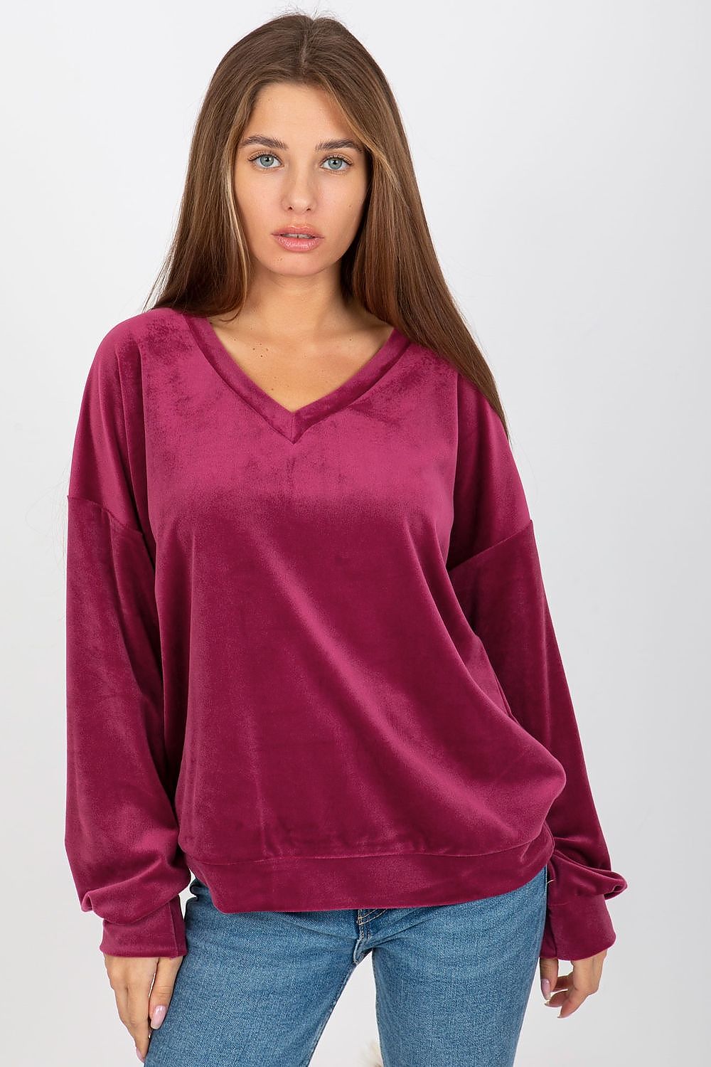 Sophisticated women's velour sweatshirt in rich burgundy, showcasing a V-neck design and long sleeves for an upscale casual look.