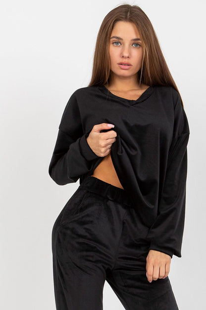 Chic close-up of a women's black velour sweatshirt with a heart neckline, accentuating its soft fabric and contemporary design.