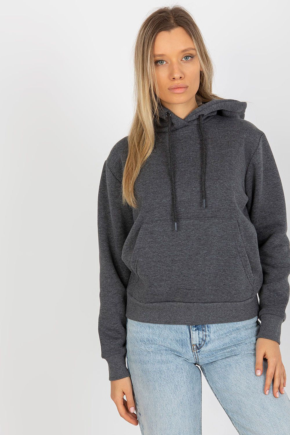 Luxury women's hooded sweatshirt by Rue Paris, featuring a kangaroo pocket, elegantly styled with jeans.