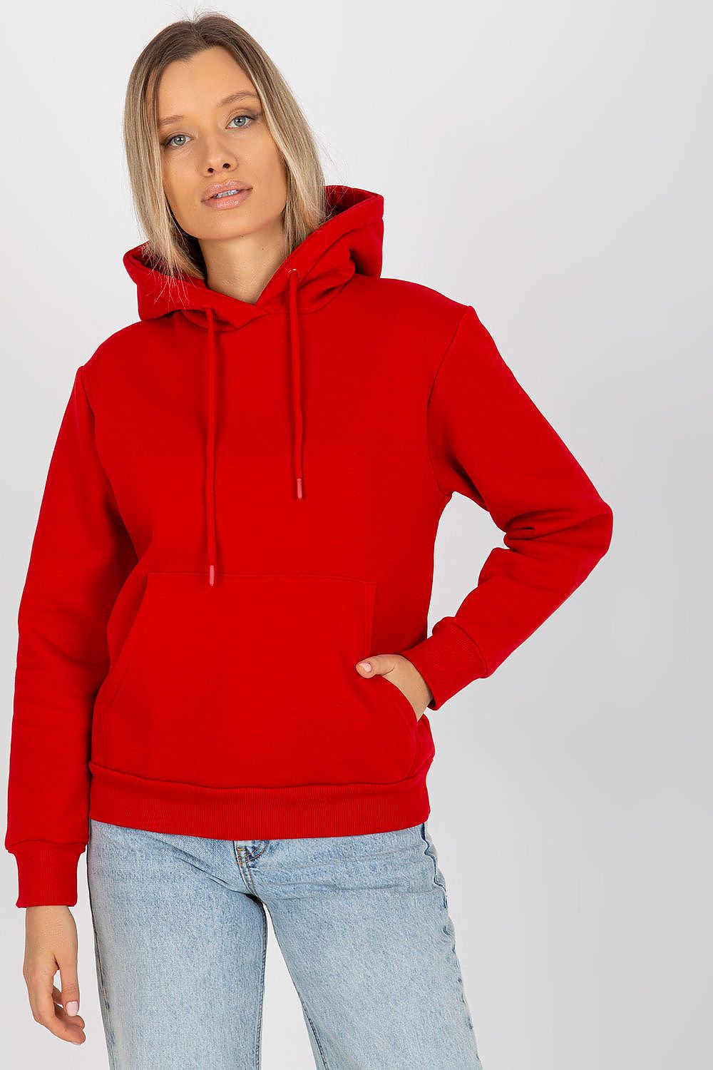 Vibrant red luxury women's hooded sweatshirt by Rue Paris, elegantly worn with jeans, perfect for casual luxury.