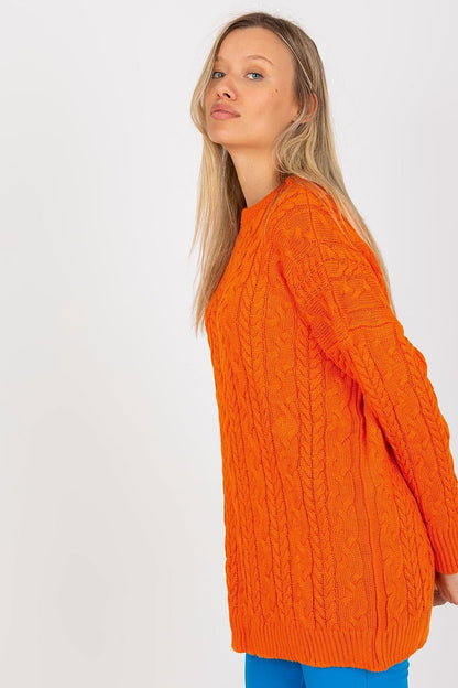 Stylish long knit sweater in bold orange, highlighting intricate cable-knit detailing, designed by Rue Paris. Perfectly tailored for a versatile look, ideal for both casual and chic ensembles.