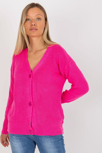Sophisticated Rue Paris Women's acrylic button-closure cardigan in striking pink, elegantly worn with denim, capturing a fashionable and luxurious ensemble.