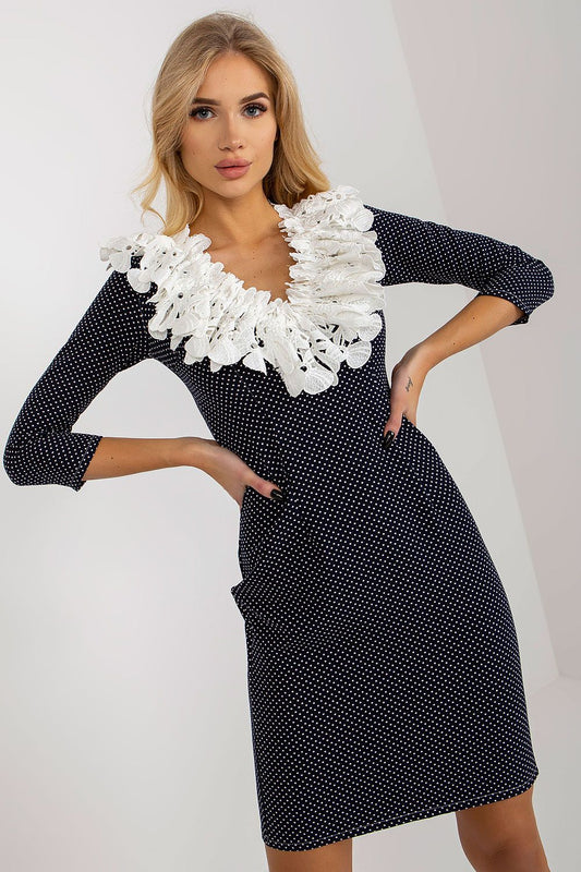 Elegant Lakerta pencil cut cocktail dress featuring 3/4 sleeves and intricate lace detailing, styled in a polka dot pattern, showcasing a chic neckline.