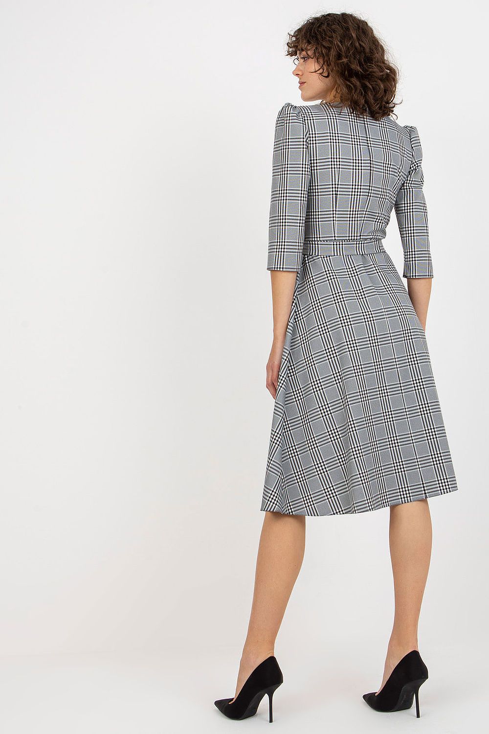 Back view of an exquisite checkered daydress showcasing a tailored fit and sophisticated waist tie. The elegant design features 3/4 sleeves and a flowing skirt, perfect for a polished appearance.