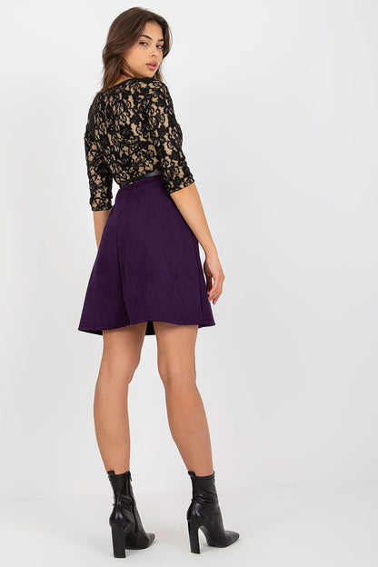 Elegant back view of a woman wearing a lace bodice 3/4 sleeve evening dress in black with a lined purple skirt and a stylish buckled belt, perfectly showcasing sophistication.