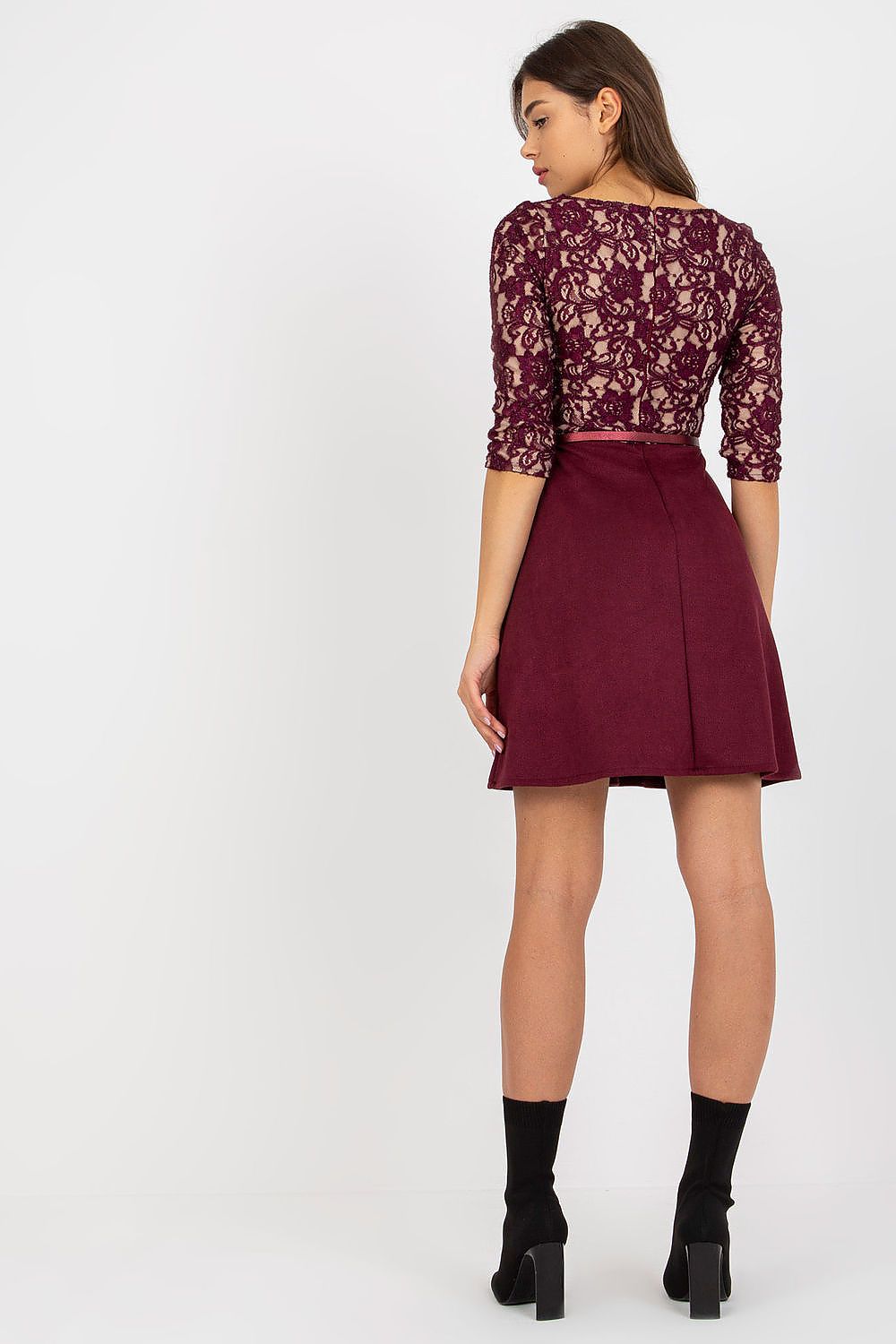 Back view of an elegant burgundy evening dress with intricate lace detailing on the top, 3/4 sleeves, and a chic lined skirt. The dress is cinched at the waist with a classy buckled belt, highlighting a refined silhouette ideal for upscale events.