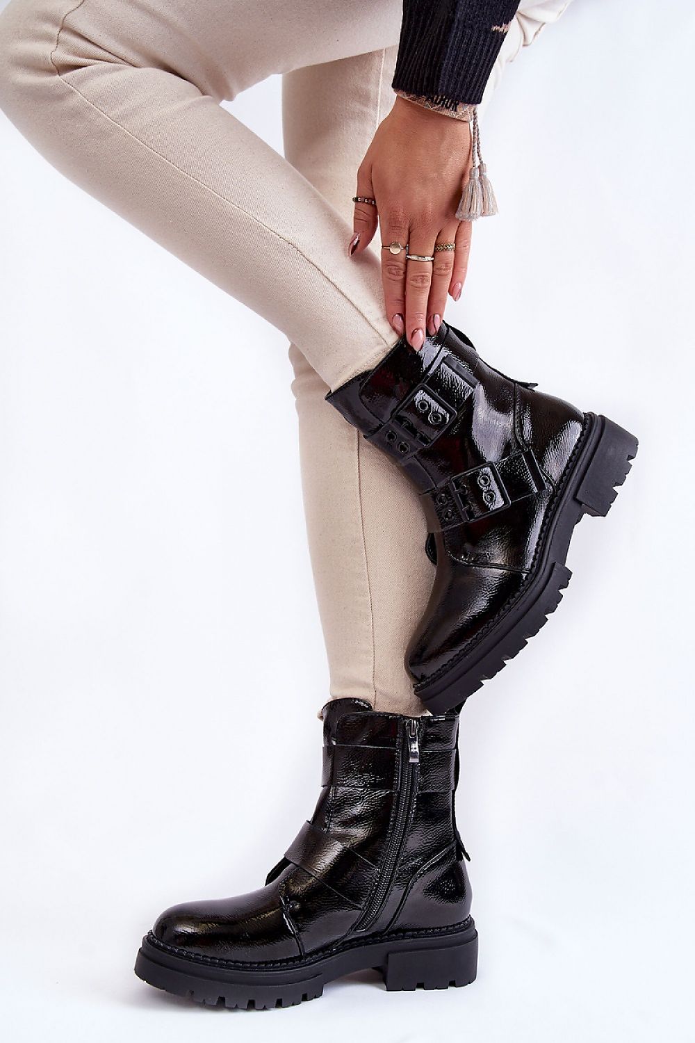 Fashionable La.Fi women's eco leather boots with side zippers, paired with fitted cream trousers, showcasing a luxurious boot design.