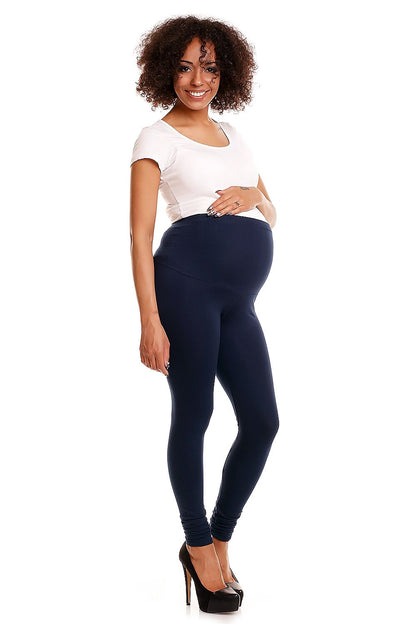 Stylish shot of a model in navy maternity leggings emphasising tummy support, complemented by a casual short-sleeve top, ideal for fashion-forward pregnant women.