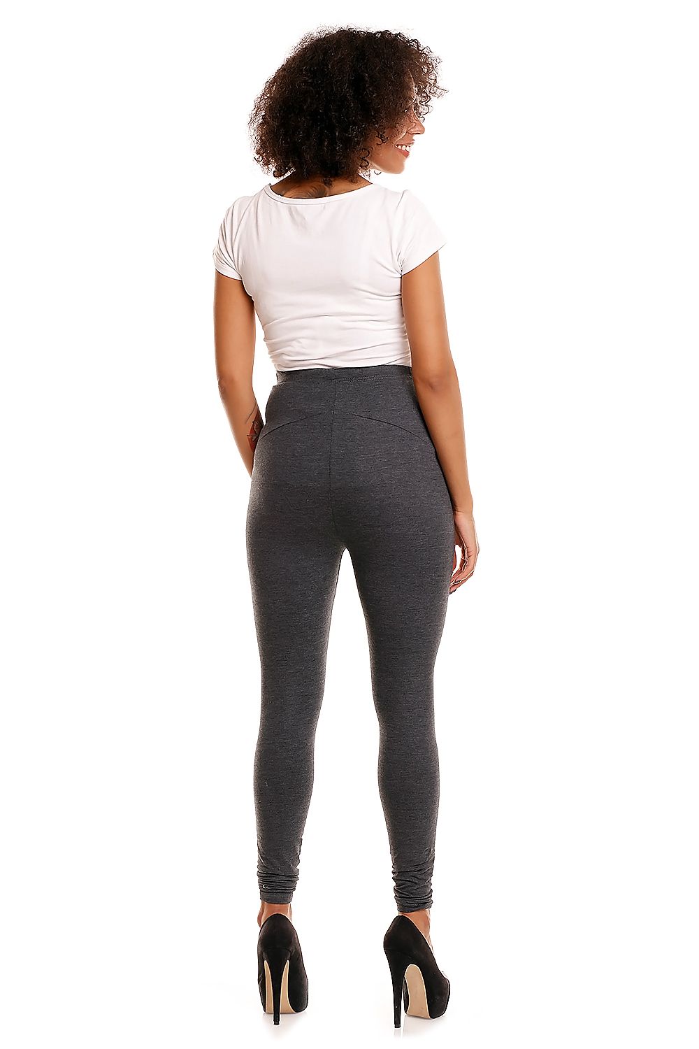 Rear view of luxury maternity leggings by PeeKaBoo on a model, highlighting the sleek design and tummy support, paired with a fitted white top and elegant high heels, perfect for stylish pregnant women.