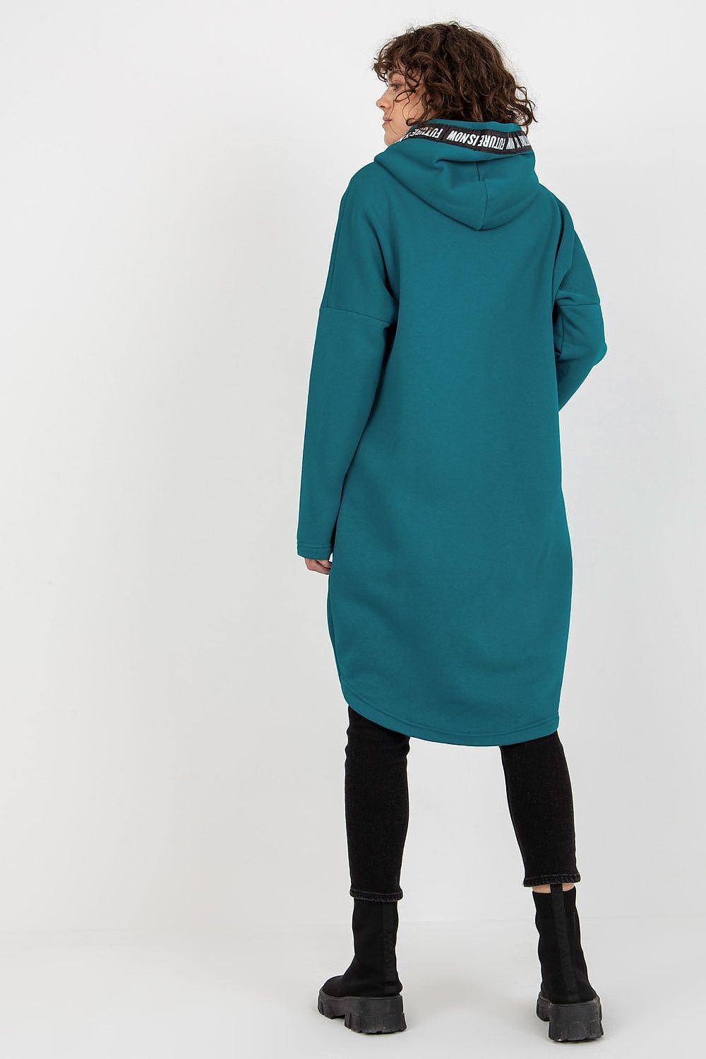 Sophisticated rear view of a women's zippered hooded sweatshirt in rich teal, highlighting the extended cut and casual elegance, paired with black leggings and stylish footwear, perfect for luxurious everyday wear.