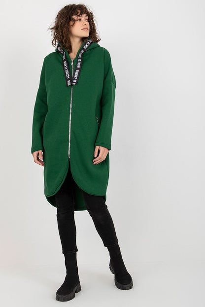 Elegant green zippered hooded sweatshirt for women, showcasing a flattering extended cut and stylish zip pockets, ideal for both casual and sophisticated looks.