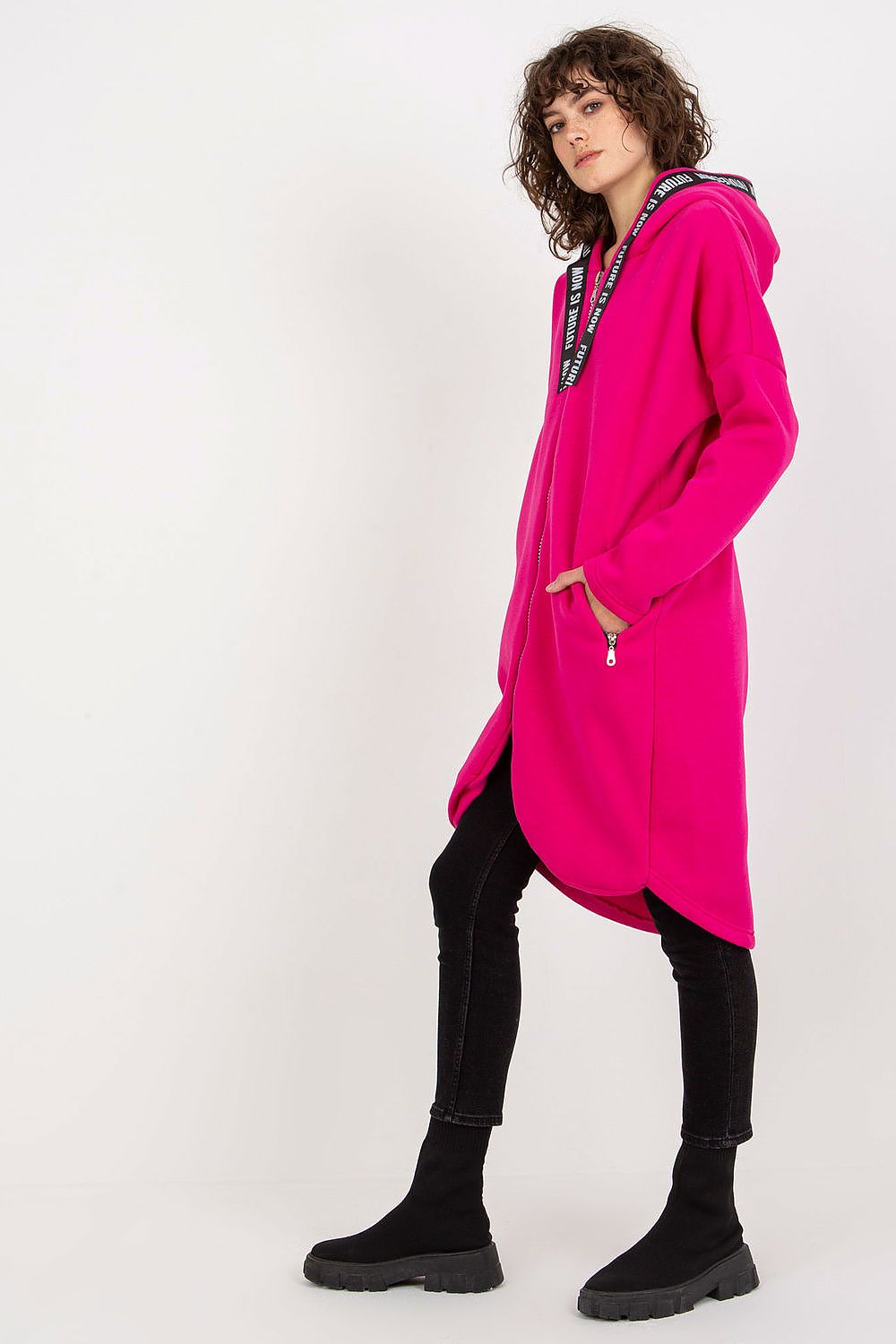 Luxury women's pink zippered hoodie with a stylish extended cut and convenient zippered pockets, ideal for a contemporary, fashionable wardrobe.