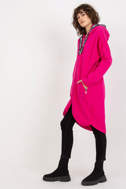 Luxury women's pink zippered hoodie with a stylish extended cut and convenient zippered pockets, ideal for a contemporary, fashionable wardrobe.