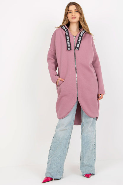 Elegant women's zippered hoodie in fashionable pink, showcasing an extended silhouette and modern zippered pockets, ideal for sophisticated casual wear.